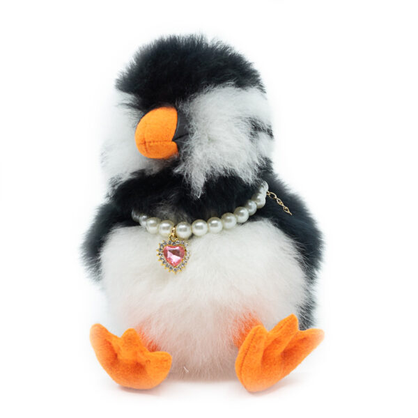 LOÐVINIR handmade puffin plush souvenir from Iceland wearing a pink necklace