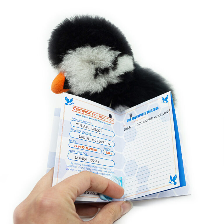 LODVINIR puffin plush toy showing its official adoption certificate tag